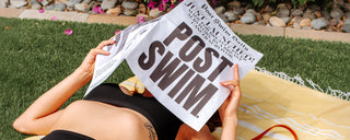 Woman holding a POST SWIM newspaper.