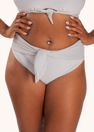 Front view - Lily Bikini Bottom in City Girl Stripe from POST SWIM in collaboration with The Chemo Club, high-rise adjustable tie front