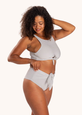 Side view - Lily Bikini Bottom in City Girl Stripe from POST SWIM in collaboration with The Chemo Club, high-rise adjustable tie front