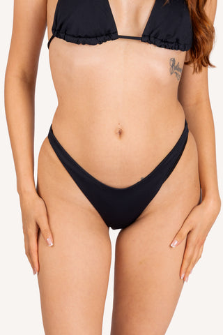 Front view, cropped - Ashley medium coverage low rise bikini bottom, black | POST SWIM