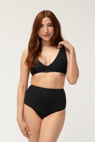 Front view, full body - flat-closure mastectomy Jen bikini top & high-waist bottom, black | POST SWIM